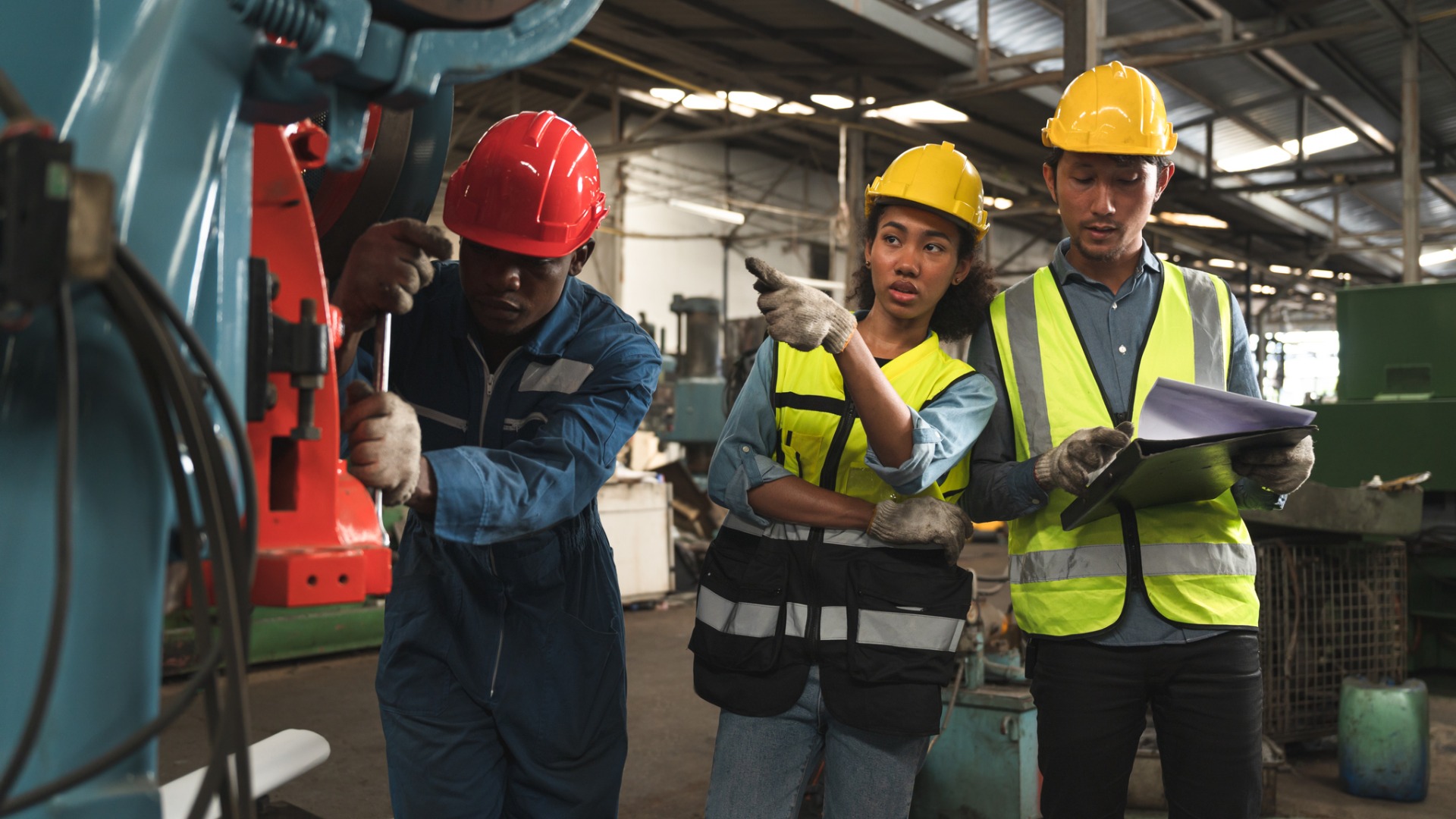 engineer-woman-and-mechanic-hard-work-with-machine-at-factory-picture-id1385918226